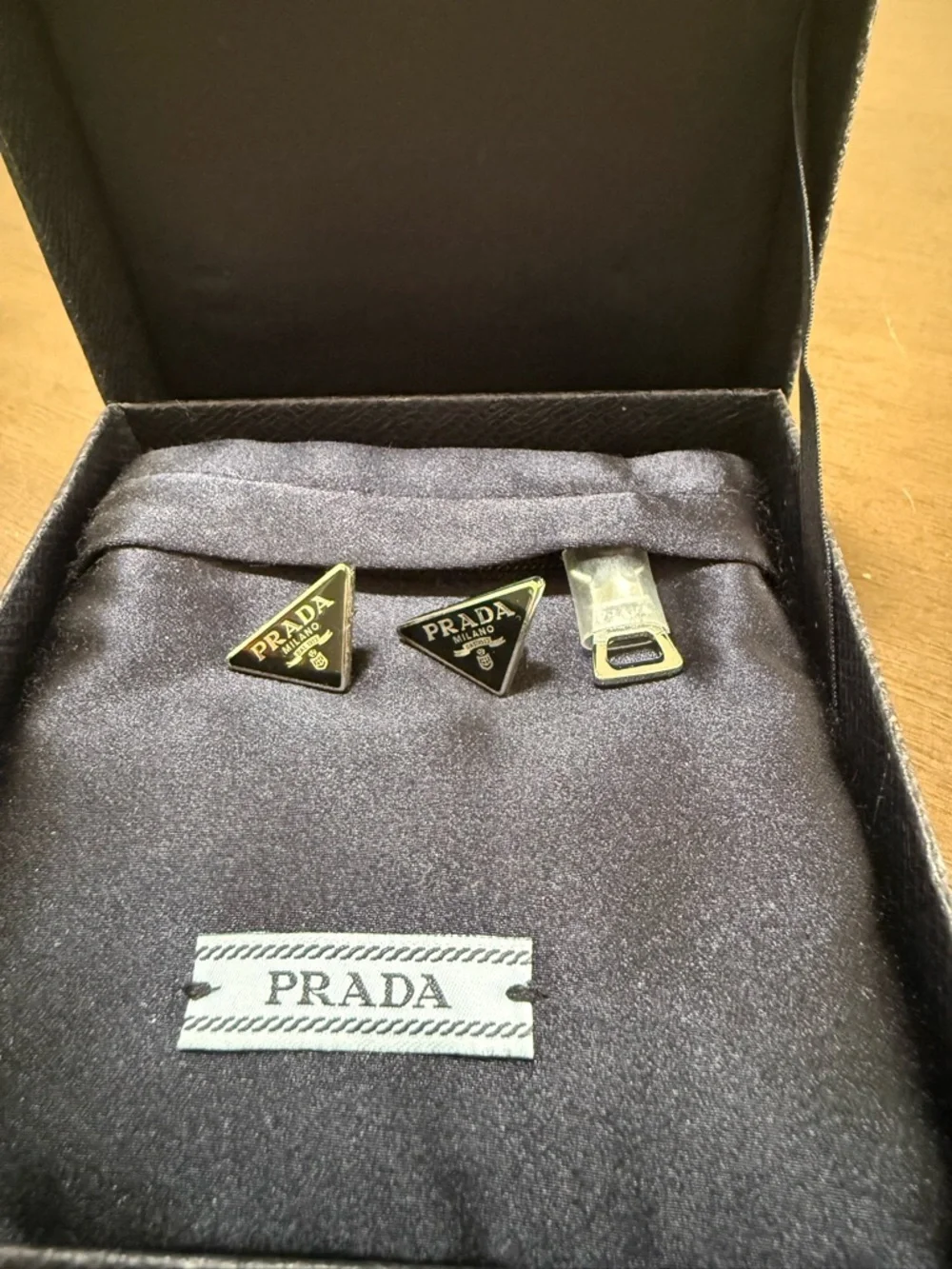 Prada Black and Silver Triangle Logo Studs - Picture 2 of 5